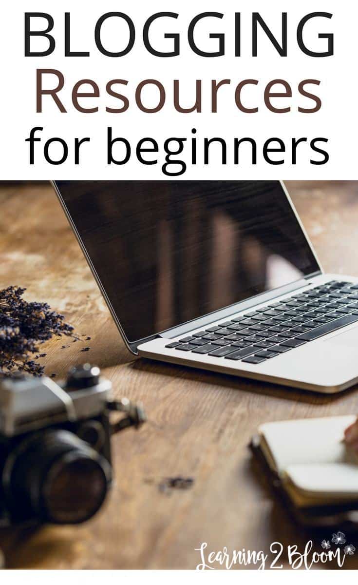 Laptop and camera on table with title "Blogging Resources for beginners"