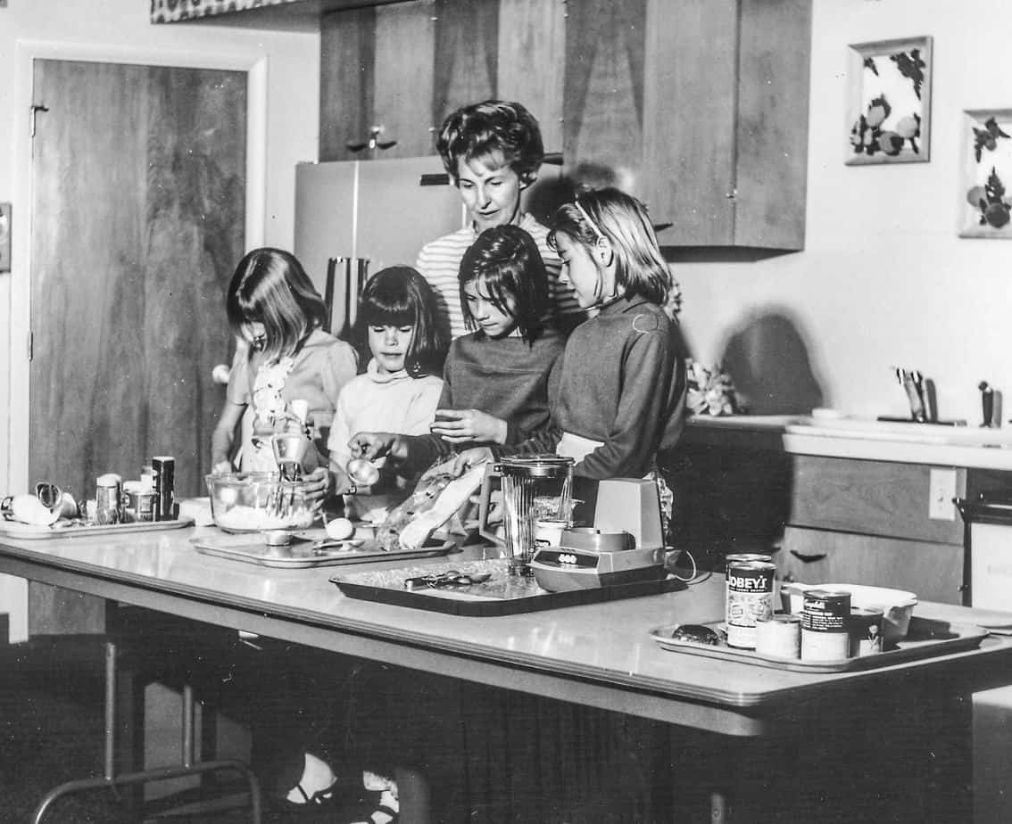 My Grandma, Clara teaching a Home Economics class to 4 young girls with Utah Power