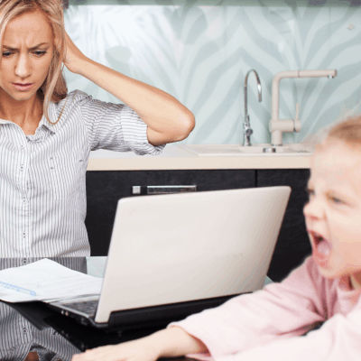 Stressed out mom holding hands over ears as daughter cries