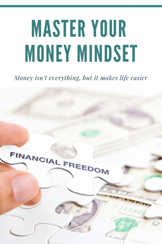 hand holding puzzle piece that says Financial Freedom with title Master your money mindset - Money isn't everything, but it makes life easier.