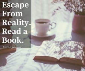 Table with hot drink and books "Escape from reality. Read a book.